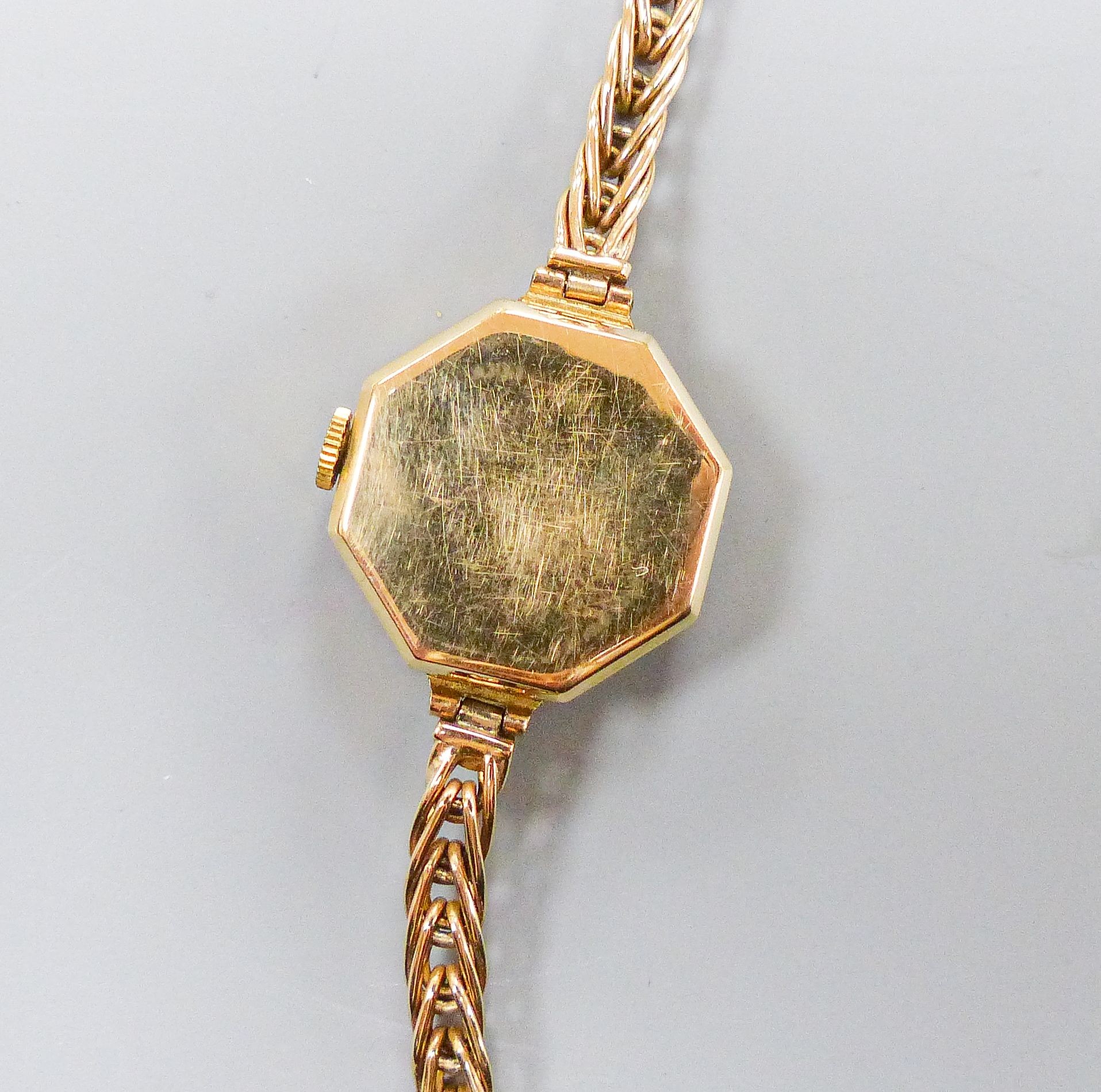 A ladys' vintage Tudor Royal 9ct gold manual wind wristwatch, having circular dial with subsidiary seconds dial in octagonal case, on a 9ct gold flexible link bracelet with safety clasp, in original box